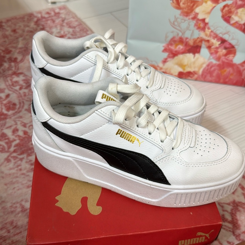 Stylish white and black PUMA platform sneakers with a chunky retro-inspired